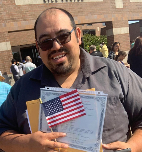 Juan Soto poses with his citizenship papers after being sworn in as an American citizen on Sept. 13, 2022. Juans path to citizenship began more than 30 years ago when he first moved to this country.