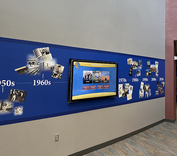 The board sits on the Learning Commons staircase, inviting students to learn about Rockhurst’s history.