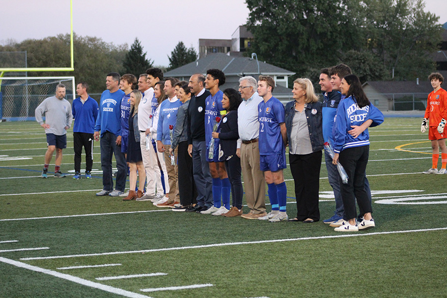 Seniors and their parents pose together after the Senior Night ceremony before the game against St. James Academy on Oct. 20, 2022.