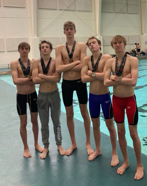 Aquahawks swimmers Charlie Huber,  Matthew Warren, Soren Ursick, Taumr Sutton and Henry Huber pose at the 2022 Boys Independent League Championship.