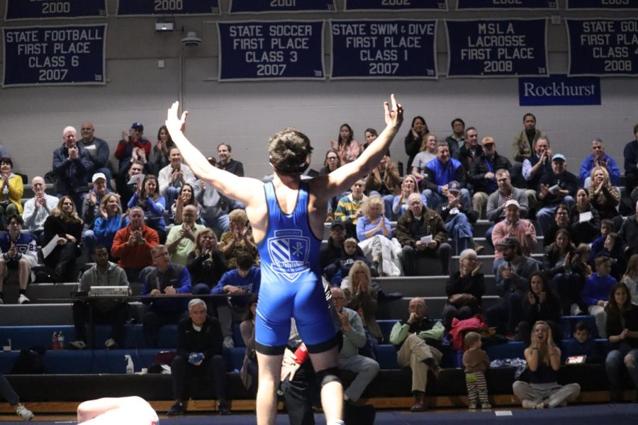 Senior+Andrew+Shipman+raises+his+arms+in+triumph+after+outlasting+his+opponent+on+Senior+Night.+Shipmans+win+helped+propel+Rockhurst+to+a+48-24+victory+over+Bishop+Miege+on+Jan.+25%2C+2023.