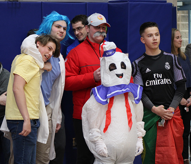 The game pieces for each class pose together for a photo before the Board Game begins on March 10, 2023. (Left to right) John Tancona, Tate Scanlon, Drew Mozena, Gray King and Nico Rodriguez Martinez