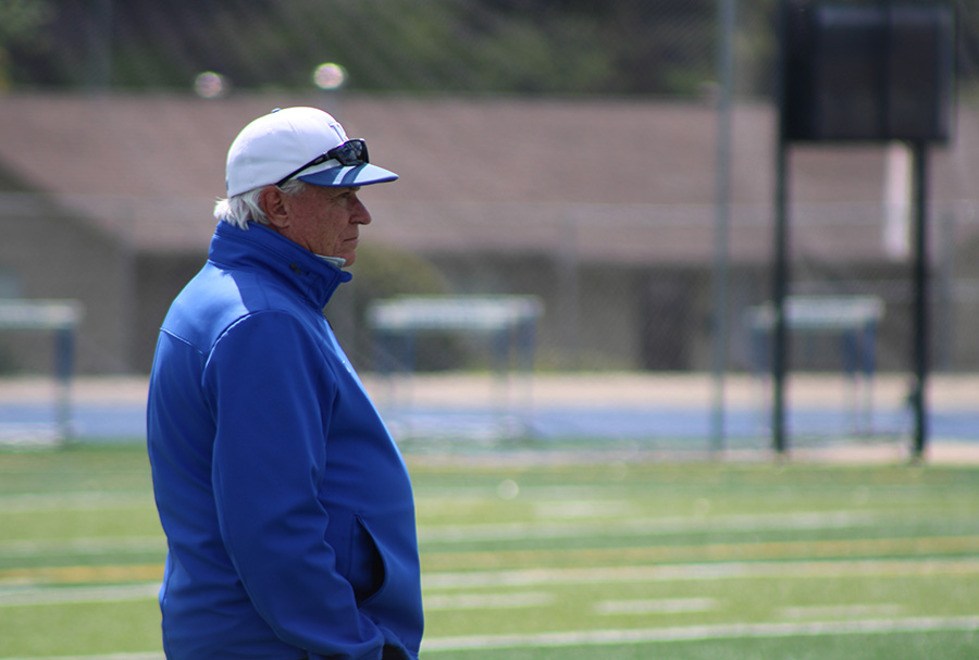 Rockhurst Athletic trainer Paul McGannon watches as the lacrosse team takes on SLUH on April 30, 2023. McGannon has been a constant at most Rockhurst athletics events since coming aboard in 2010.