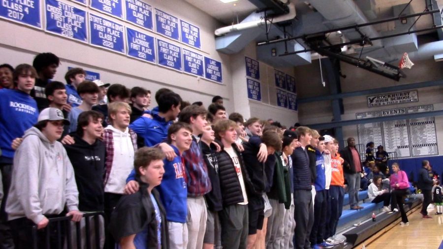 The student section sings the Rockhurst alma mater after the basketball team defeated Lincoln College Prep on Feb. 17, 2023.