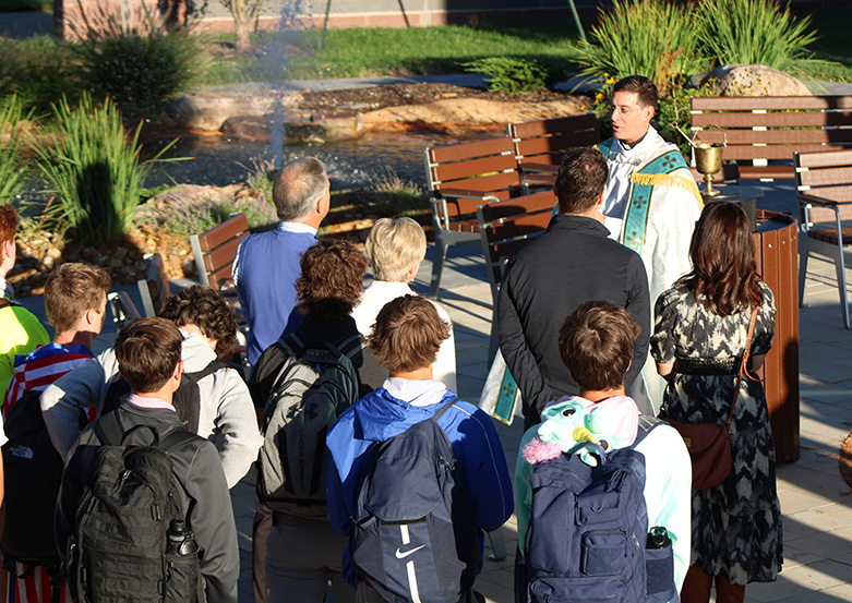 Principal Father Vincent Giacabazi addresses those gathered for the dedication of the Jack Nestor 34 Outdoor Classroom & Lab on Sept. 25, 2023.