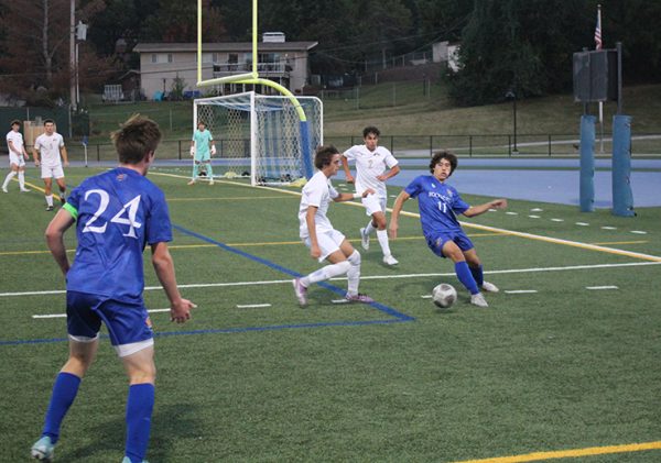 Senior defender Henry Mullen (24) awaits the play by sophomore forward Aidan Poynter. Poynter would score one of Rockhursts four goals in their shutout win over Lees Summit on Sept. 14, 2023.