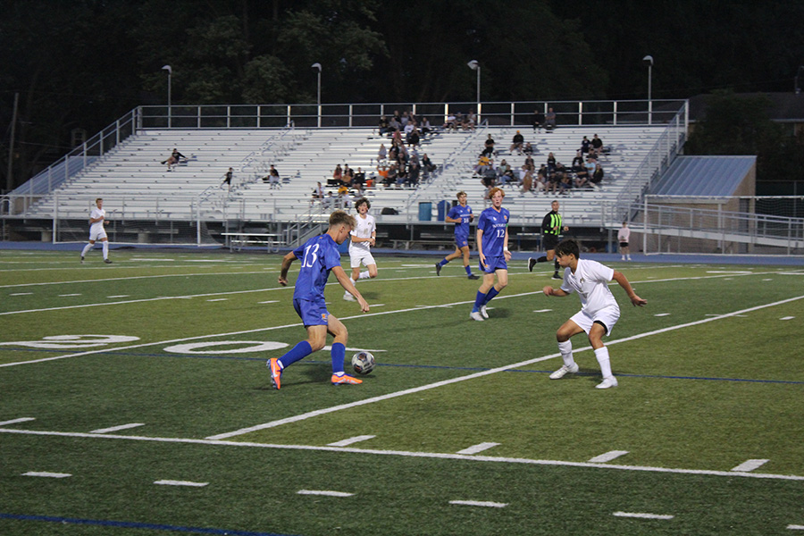 Senior forward Liam Ver Meer looks for an opening to get by a Lees Summit defender. Ver Meer would tally one of Rockhursts goals in their 4-0 win over the Tigers on Sept. 14, 2023.