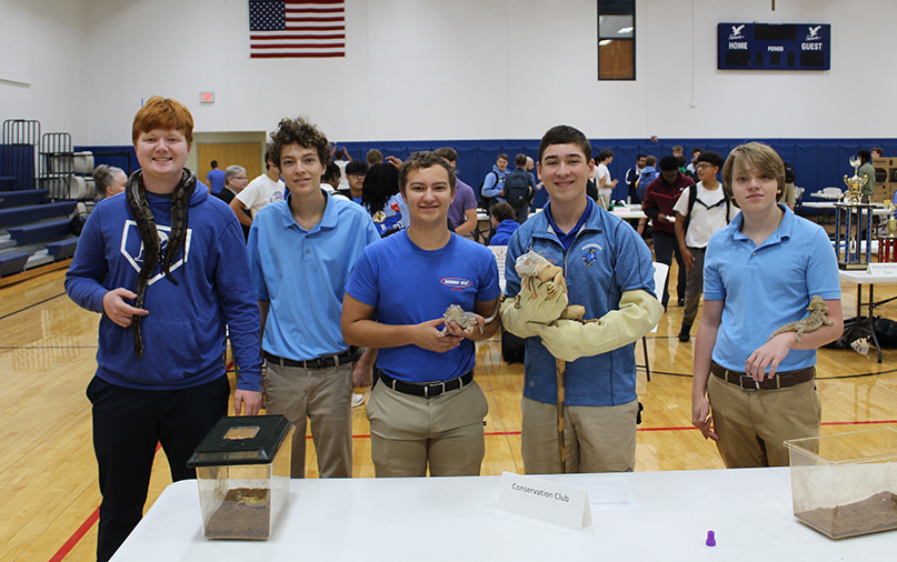 Joe Brandtonies, Jacob Carpenter, ??, Michael Redlich and ?? pose with some of the reptiles the Conservation Club had on hand for the Freshman Club Fair on Sept. 21, 2023.