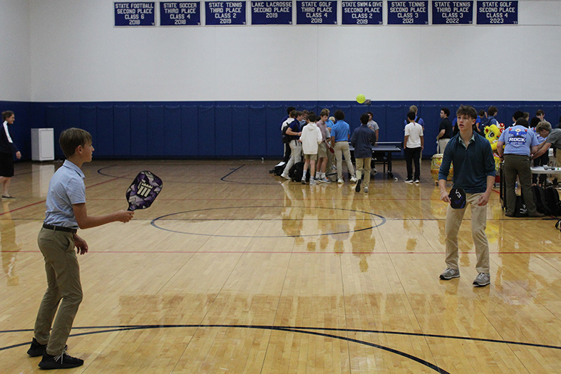 Jude Bailey and ?? take a turn at hitting the pickleball back and forth during the Freshman Club Fair on Sept. 21, 2023.