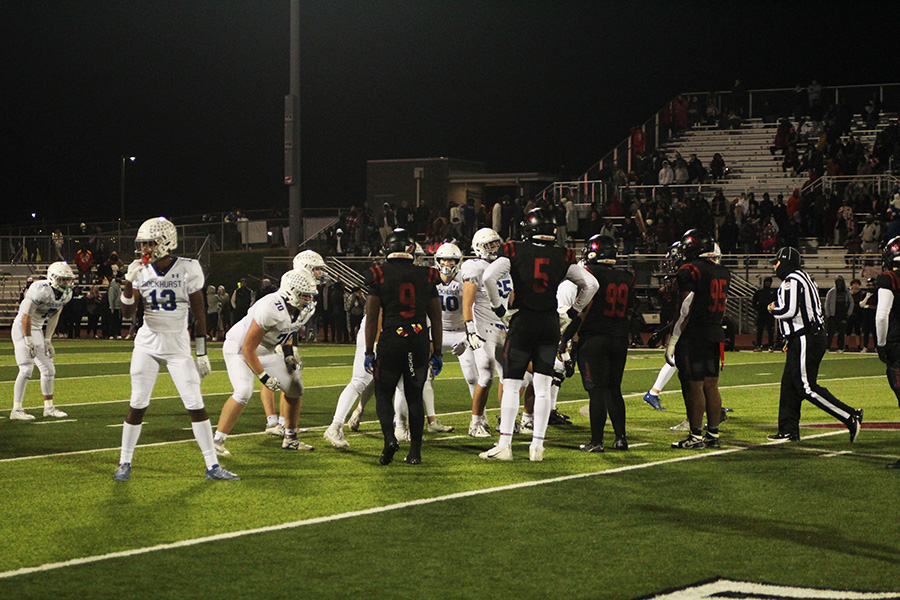 Rockhurst lines up in victory formation to run out the clock in the district championship game against Lee's Summit North on Nov. 10, 2023. It was the Hawklets' first district crown in football since 2018.