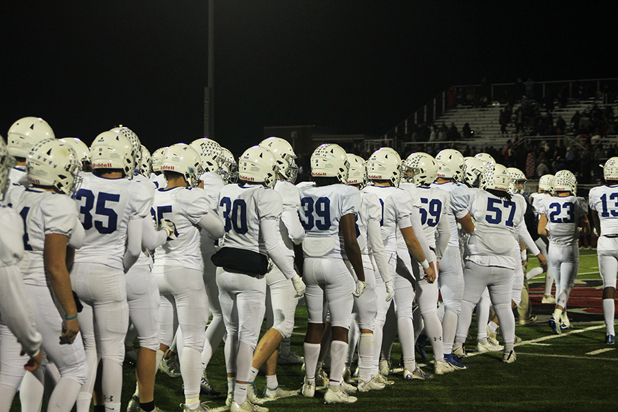 Rockhurst players line up to shake hands with Lee's Summit North after beating the Broncos on Nov. 10, 2023 to claim the district championship. It's the Hawklets' first district crown in football since 2018.