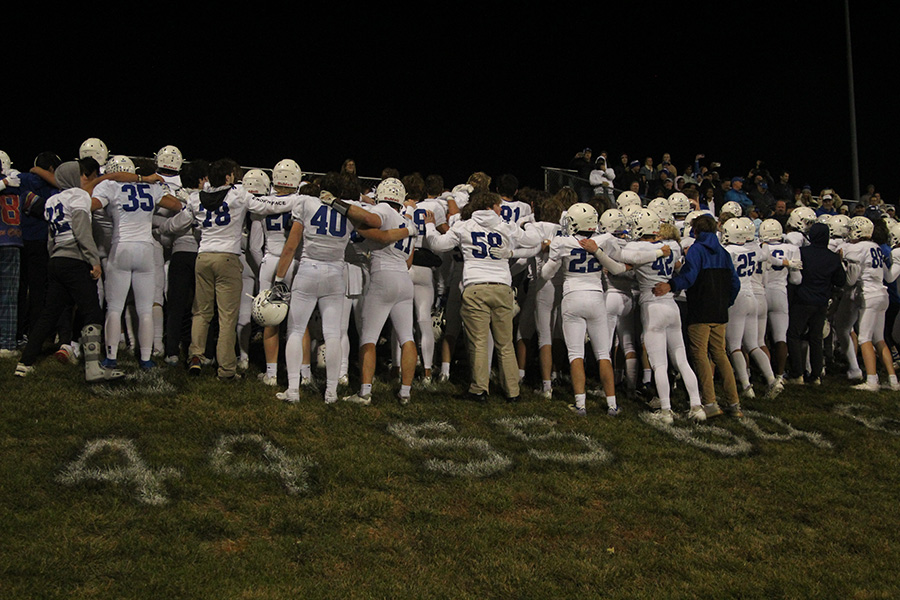 The football team sings the Rockhurst alma mater with fans after beating Lees Summit North on Nov. 10, 2023 to claim the district championship. Its the Hawklets first district crown in football since 2018.