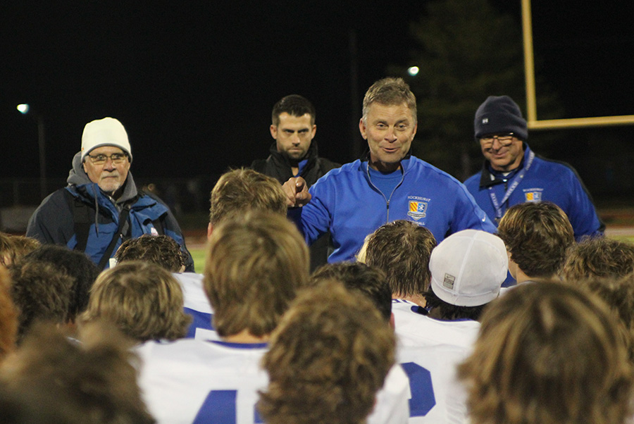Head coach Kelly Donohoe addresses the team after they beat Lees Summit North on Nov. 10, 2023 to claim the district championship. Its the Hawklets first district crown in football since 2018.