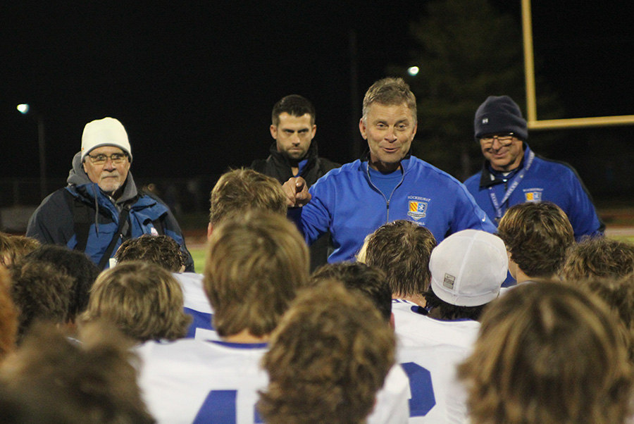 Head coach Kelly Donohoe addresses the team after they beat Lee's Summit North on Nov. 10, 2023 to claim the district championship. It's the Hawklets' first district crown in football since 2018.