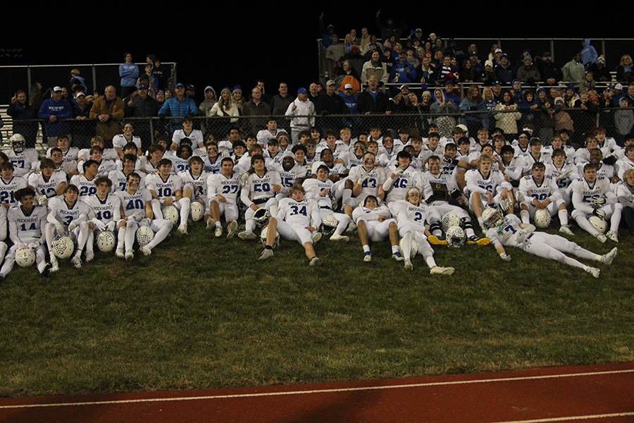 The team poses in front of their parents after beating Lees Summit North on Nov. 10, 2023 to claim the district championship. Its the Hawklets first district crown in football since 2018.