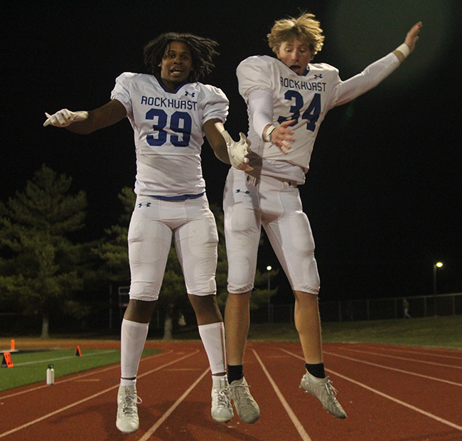 Seniors Gerald Wright-Pounds and Matt Mears celebrate after the football team beat Lee's Summit North on Nov. 10, 2023 to claim the district championship. It's the Hawklets' first district crown in football since 2018.