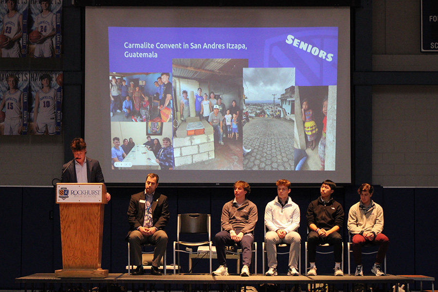 Senior class president Colin Komenda talks about the Carmalite Convent in San Andres Itzapa in Guatemala during the Mission Week kickoff assembly on Feb. 23, 2024. The convent is where senior class donations will go to during Mission Week. Many members of the senior class stayed at the convent during their senior service projects in Guatemala, which is why they wanted to support the group.