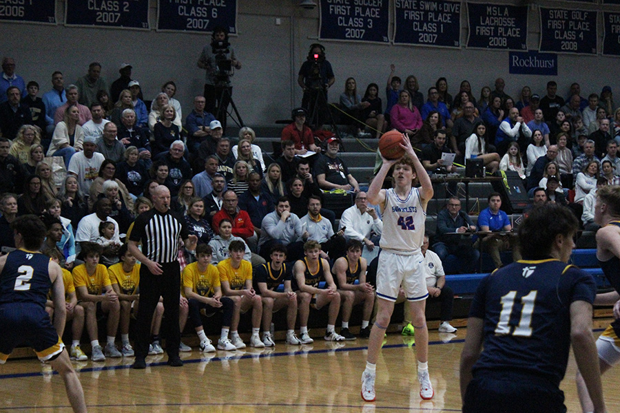 Sophomore Kevin Sullivan puts up the wide open 3-pointer during the game against St. Thomas Aquinas on Feb. 2, 2024. Sullivan had a team-high 11 points--including two 3-pointers--in the Hawklets 52-38 win over the Saints.