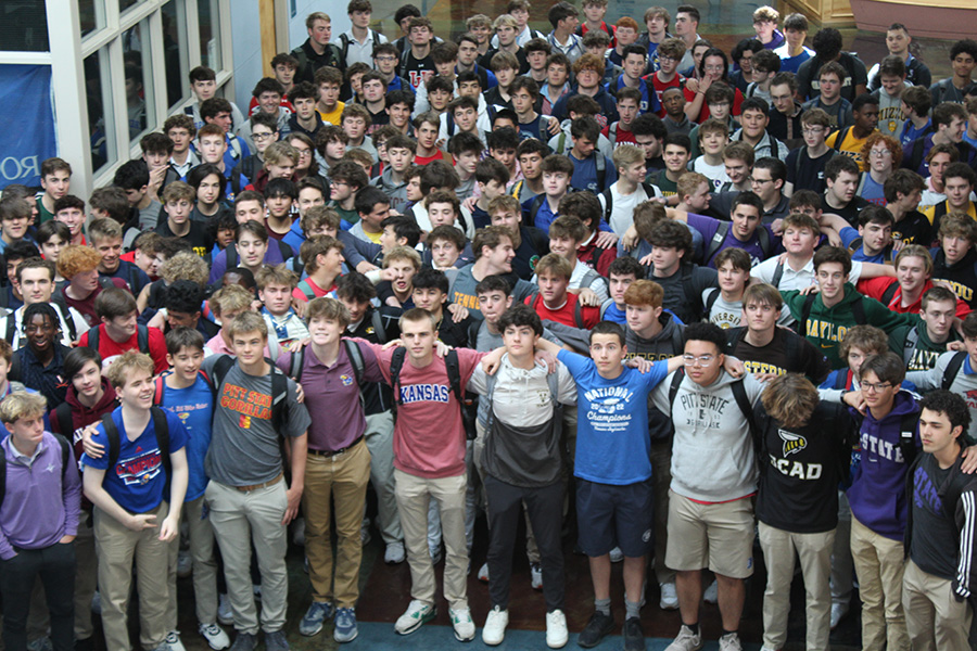The Class of 2024 poses for a group picture on April 24, 2024 decked out in shirts bearing their college destination.