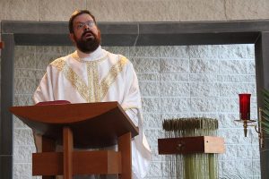 Father Daniel Tesvich, SJ, delivers his homily during the May Father/Son Mass on May 7, 2024.