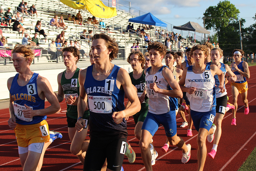 Juniors Henry Acorn (2) and Andrew Davis (5) compete in the 1600m run finals of the Shawnee Mission North Relays on May 3, 2024. Acorn would finish third in 4:15.86 with Davis right behind him in fourth (4:16.81).