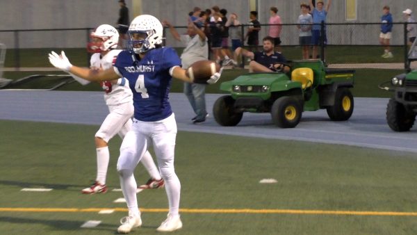 Sophomore Blake Thomas celebrates after scoring his third touchdown of the game during Rockhurst's 42-25 win over Olathe North on Sept. 13, 2024.