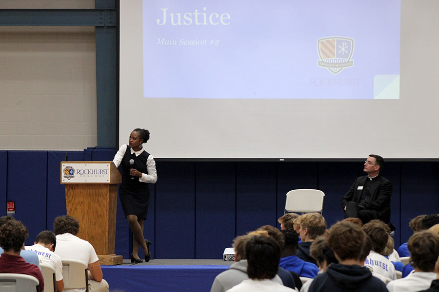 Danielle Brown from the USCCB talks to the Rockhurst student body about the topic of justice on Men for Others Day on Sept. 9, 2024 as principal Father Vincent Giacabazi looks on. The topic was one of three Brown addressed on this day intended to help the students understand what it looks like to be a 'man for others'.