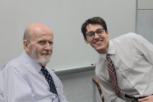 English teacher Andy Hagedorn poses with senior Charlie Perricelli in May of 2023.