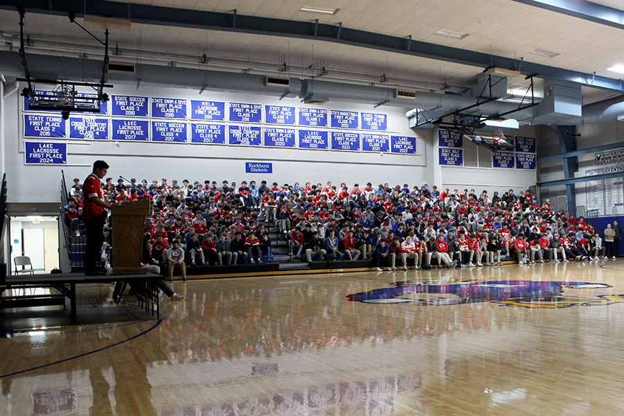 Sophomore class president Tristan Batobalani talks about the organization their donations will support, Catholic Charities, during the Mission Week kickoff assembly on Feb. 7, 2025.