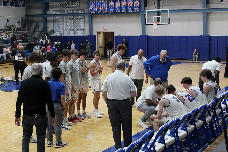 Coach Billy Thomas talks with his team during a timeout in Rockhurst's game against Lee's Summit North on Dec. 16, 2025. The Hawklets beat the Broncos 73-48 to move to 6-1 on the season.