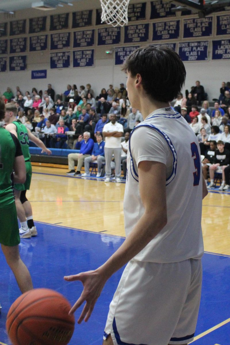 Junior Jack Hoover readies to inbound the ball against St. Michael the Archangel on Feb. 26, 2025. Hoover and the Hawklets picked up a 63-40 win on this night to close out their regular season with a 20-4 record. It was their first 20-win campaign in six seasons.