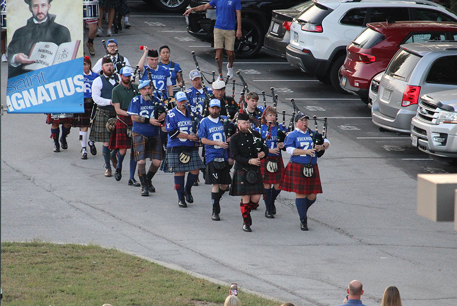 A pipe band leads the procession of 
