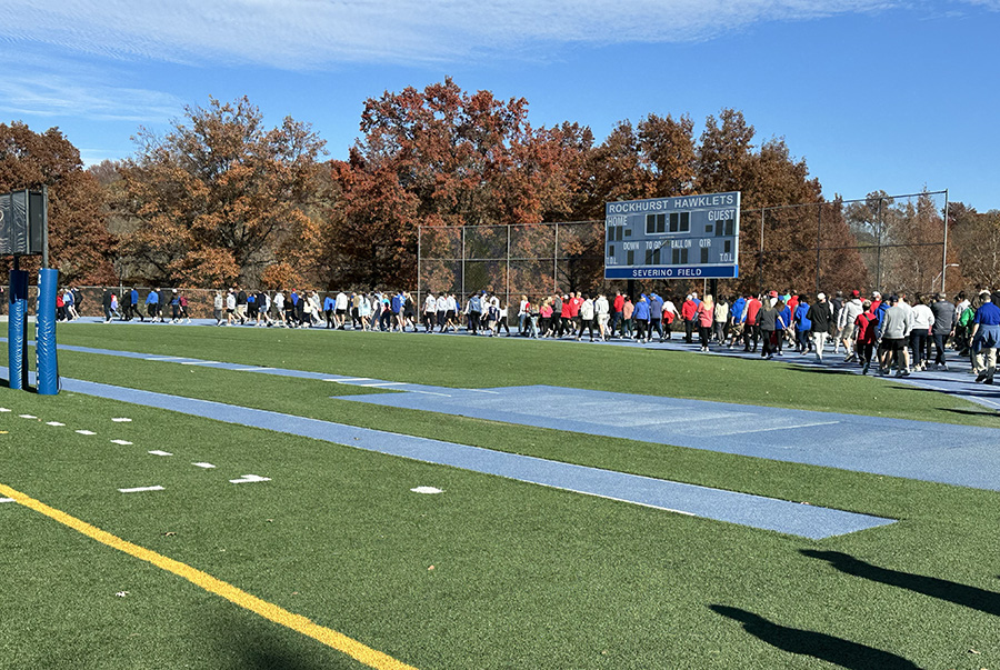 Participants in the Walk-a-Thon for Kadence Hailey make their way around the Rockhurst track on Nov. 16, 2025.