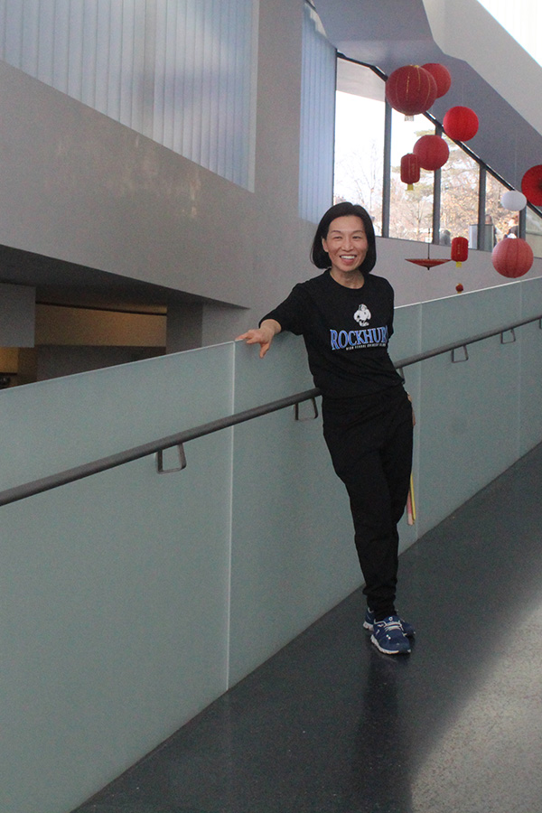Rockhurst Mandarin teacher and Lion Dragon Squad moderator Jackie Shao waits for her team to perform at Nelson-Atkins Museum of Art Lunar New Year celebration on Jan. 26, 2025.