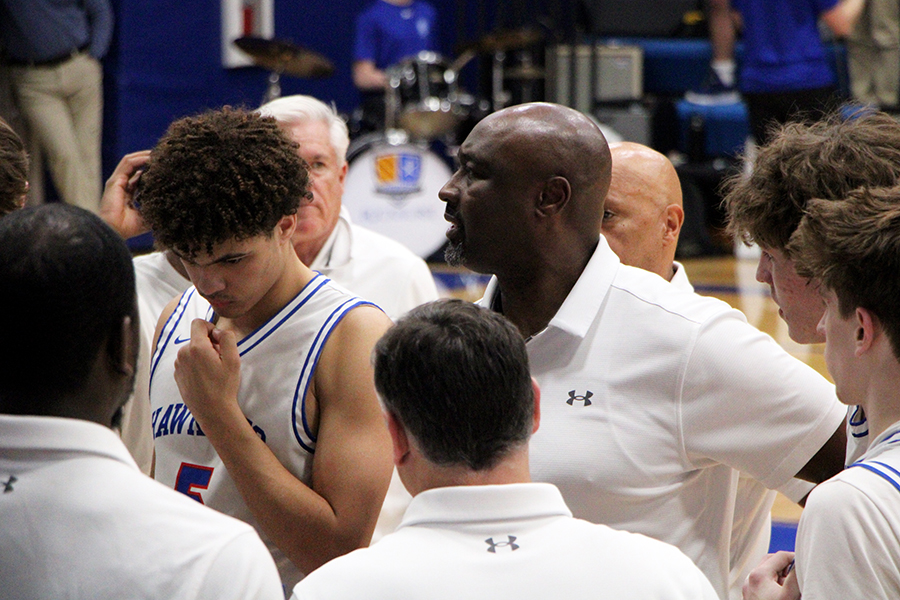 Head coach Billy Thomas talks to his team during a timeout late in the game against Pembroke Hill on Feb. 10, 2026.