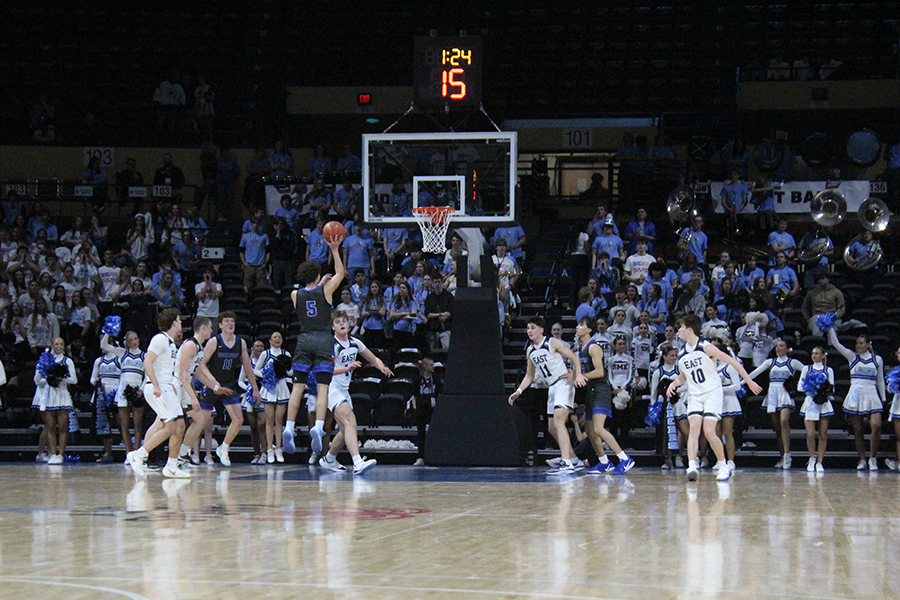 Senior Hueston Saunders puts up the floater in the first half of the rivalry game against Shawnee Mission East on Jan. 30, 2026. The basket would provide two of Saunders' 14 points in the Hawklets' 56-51 win, their fourth straight in the series. This was the first year the game was played at Municipal Arena in downtown Kansas City as opposed to on the campus of one of the schools.