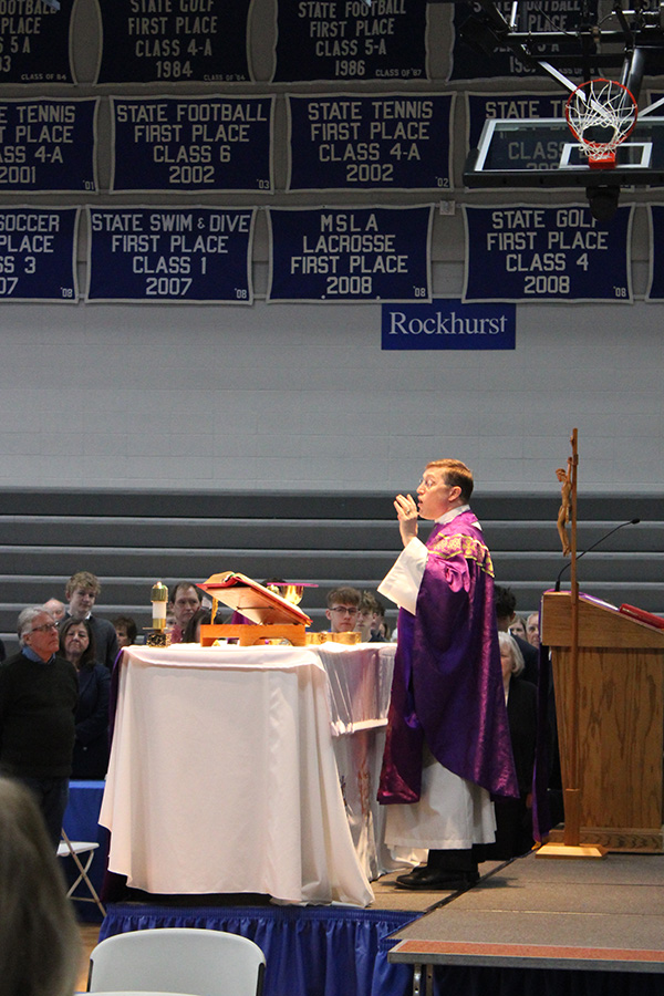 Rev. Stephen Kramer, S.J. prays over the elements as part of the Liturgy of the Eucharist during the Grandparents Mass and Brunch on March 1, 2026.